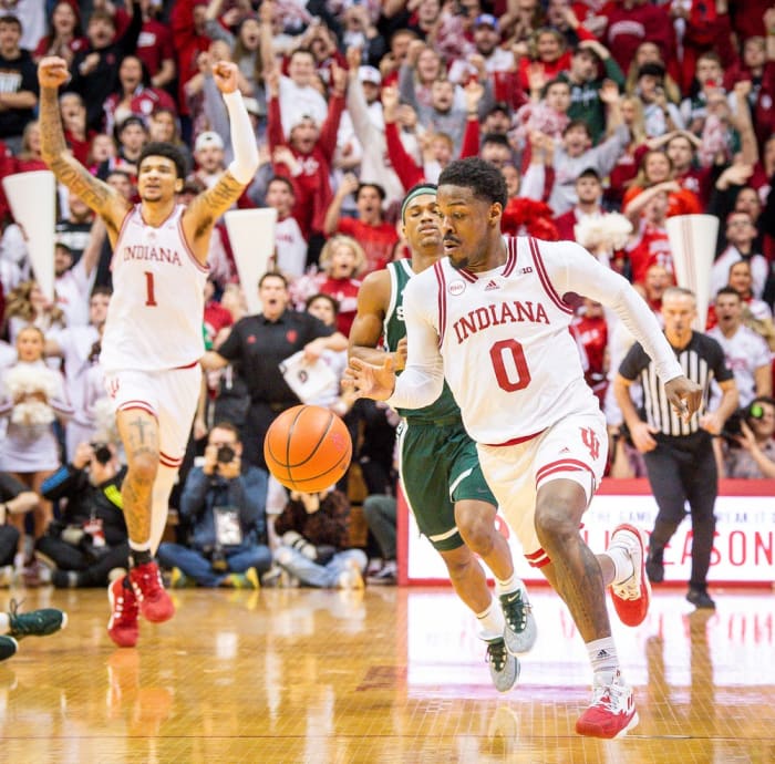 Indiana's Xavier Johnson (0) runs out the clock as Kel'el Ware (1) starts celebrating the victory during Indiana's game against Michigan State at Simon Skjodt Assembly Hall on Sunday, March 10, 2024.